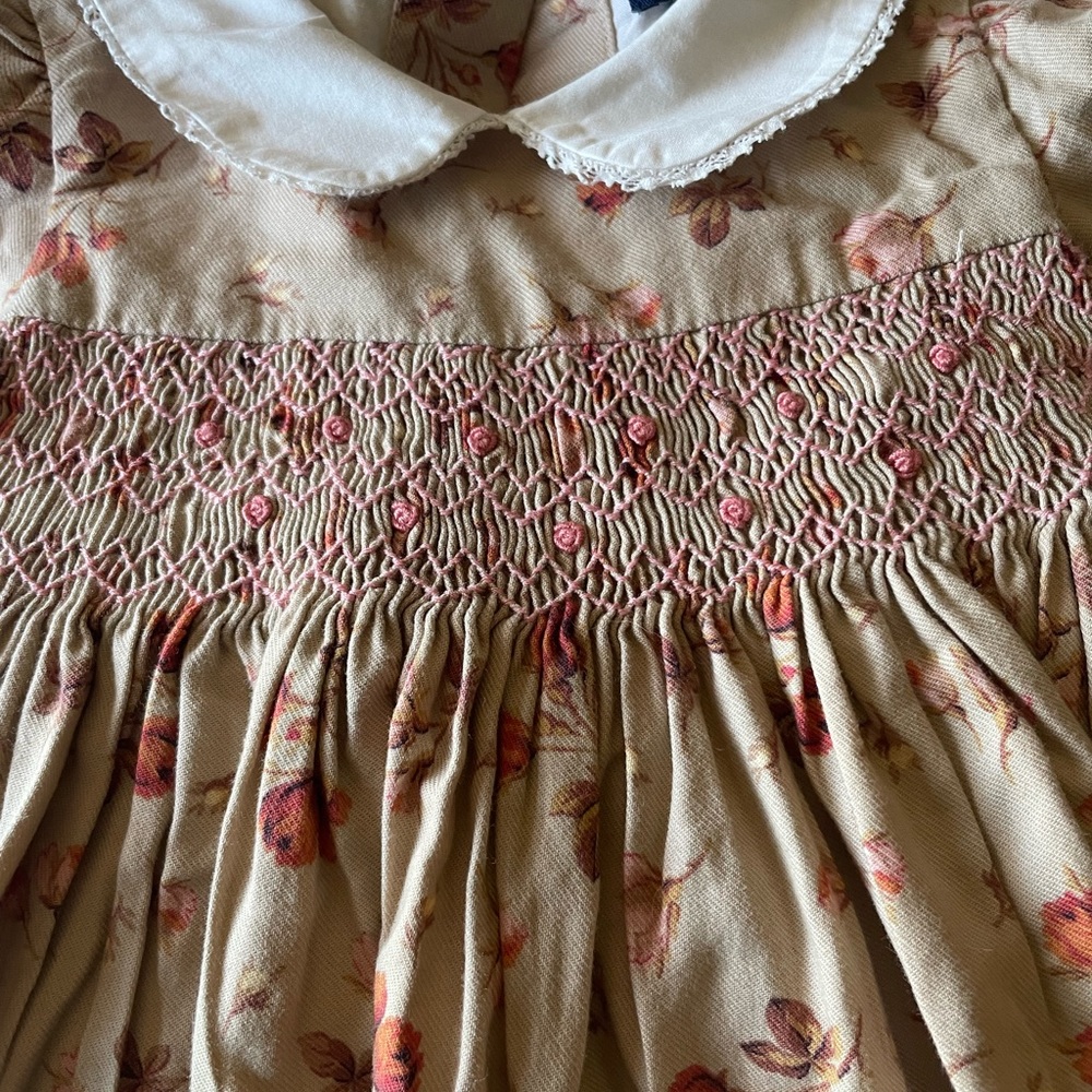 Beautiful girl 12 month smoked dress. Long sleeve, covered buttons, white collar